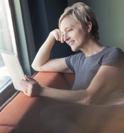 woman sitting by window