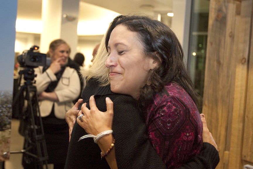 Melinda Peterson hugs Angela Wilson