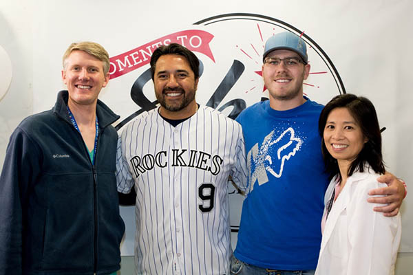 Schroder poses with his surgeon, Nicholas Cost, Vinny Castilla (center) and medical oncologist, Elaine Lam, right. They helped him cope with testicular cancer.