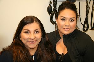 Phyllis Sanchez (left) and daughter Monica the day before Phyllis’s second chemotherapy treatment at the University of Colorado Cancer Center Aug. 31. Sanchez is the first patient at the Cancer Center to use the DigniCap to minimize the hair loss caused by her chemo.