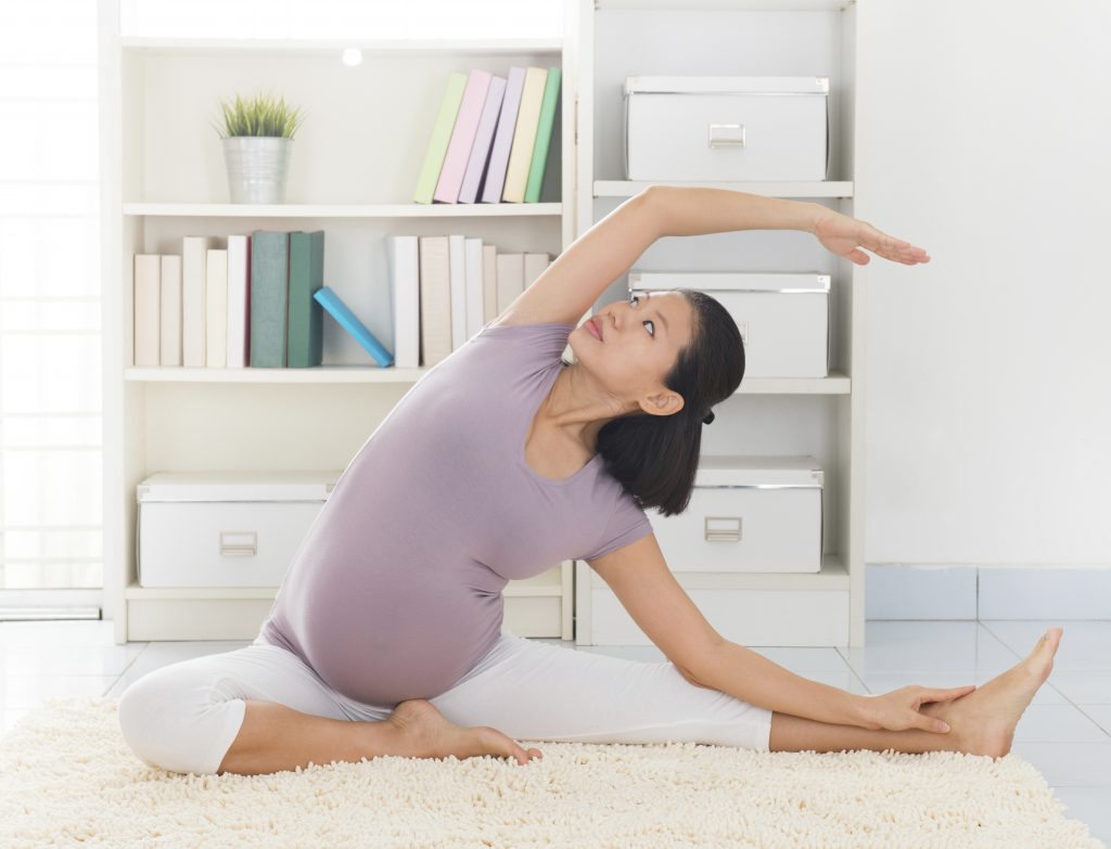 Pregnant woman doing yoga