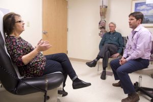 Diane and her husband Dan speak with her doctor, Jonathan Schoen.