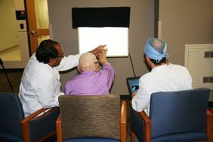 Patient Raymond Graber, a UCHealth patient, gets his first view of light with his bionic eye