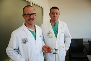 Dr. Erik Peltz and Dr. Robert Meguid pose for a photo.