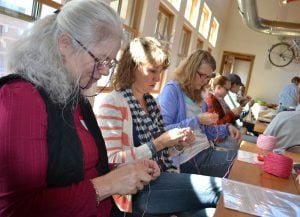 Janet Slagle and Randine Nelson, both of Fort Collins are shown knitting at the Knit for a Cause Knit-A-Thon in Fort Collins.