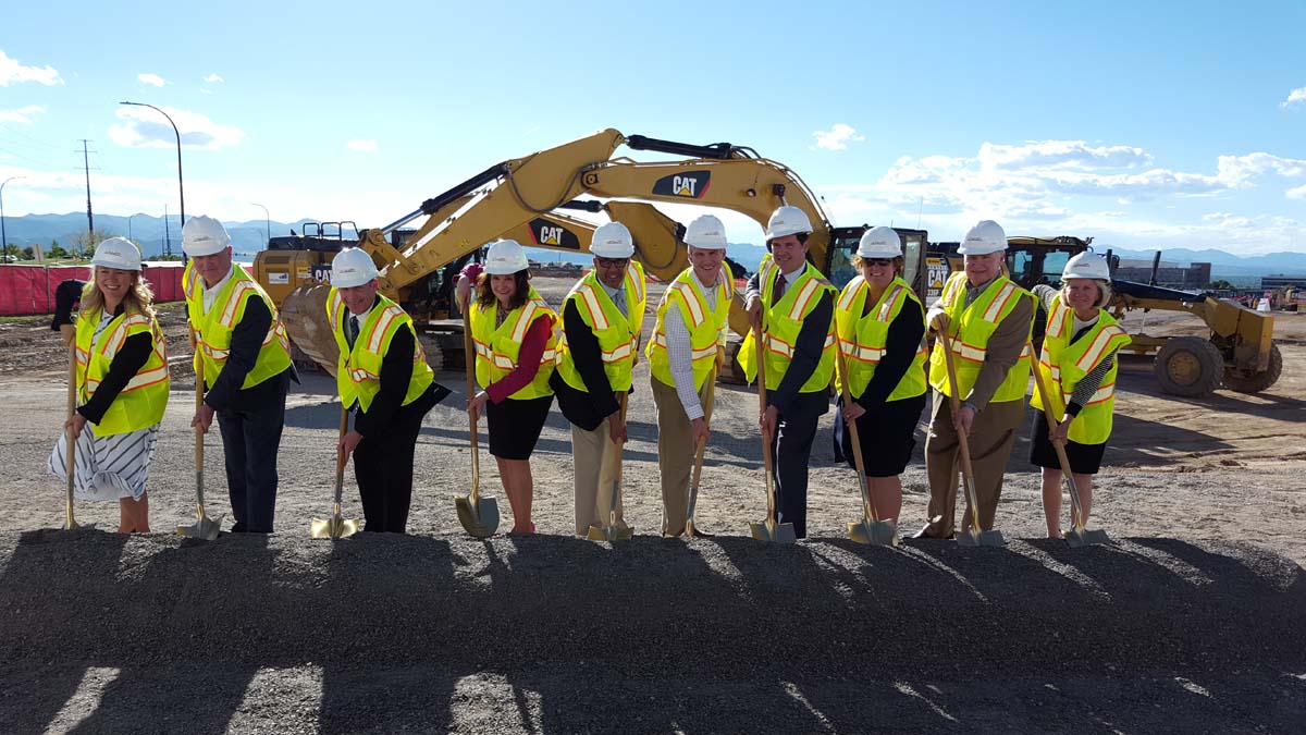 A big group of people in yellow vests and construction helmets gathers at UCHealth Highlands Ranch Hospital for a groundbreaking on May 24, 2017. From left, Amy Sherman, president of Northwest Douglas County Economic Development Corp., John Kilrow, senior vice president of Colorado Development, Dr. Tom Purcell, chief medical officer for UCHealth Highlands Ranch Hospital, Lori Thomas, Douglas County commissioner, Sean Menogan, vice president UCHealth Facilities Design and Construction, Mike Ross, senior project manager for Mortenson, Will Cook, president and CEO of UCHealth University of Colorado Hospital, Diane Cookson, president and CEO of UCHealth Highlands Ranch Hospital, Robert Golden, South Metro Denver Chamber of Commerce president and CEO, and The Rev. Julie Swaney, UCHealth senior chaplain and manager of Spiritual Care Services at UCH.