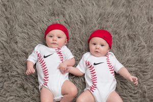 professional photograph of twins Lucas and Gabrie in baseball outfits