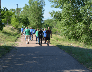 Dr. Laurence (Larry) Cohen leads a group of walkers along the Pikes Peak Greenway Trail in Colorado Springs. On Sunday mornings, Cohen hosts a "Walk with a Doc'' outing.