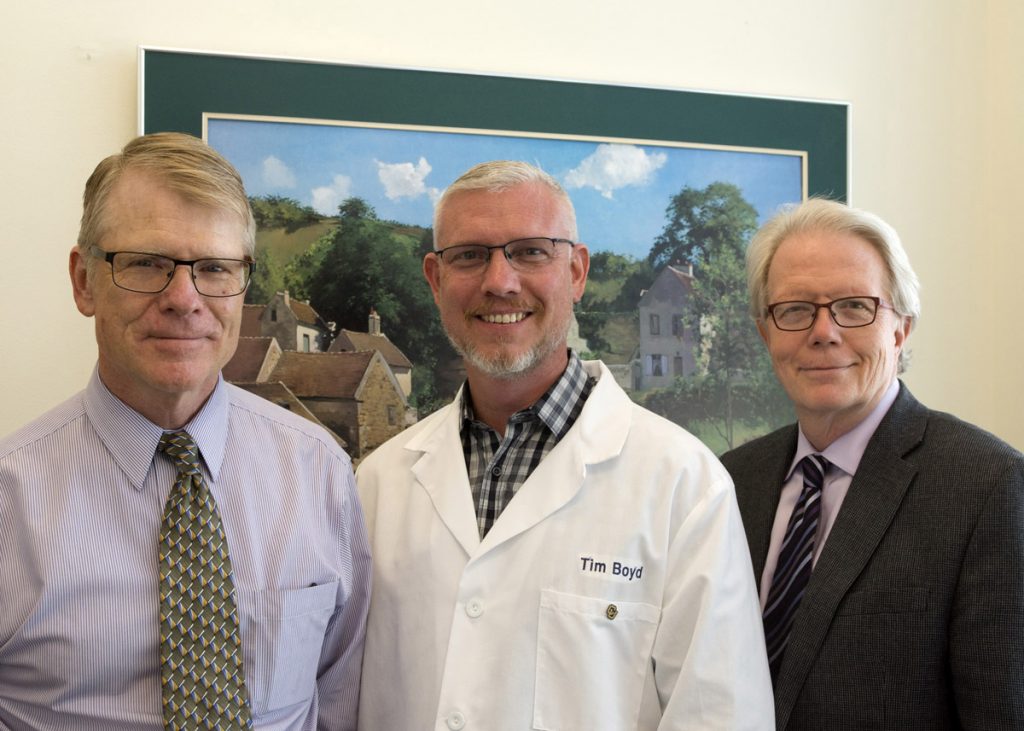 This is a photo of the Rocky Mountain Alzhiemer's Disease Center team leading leukine work and includes Jonathan Woodcock, MD, Tim Boyd, PhD, and Huntington Potter, PhD.