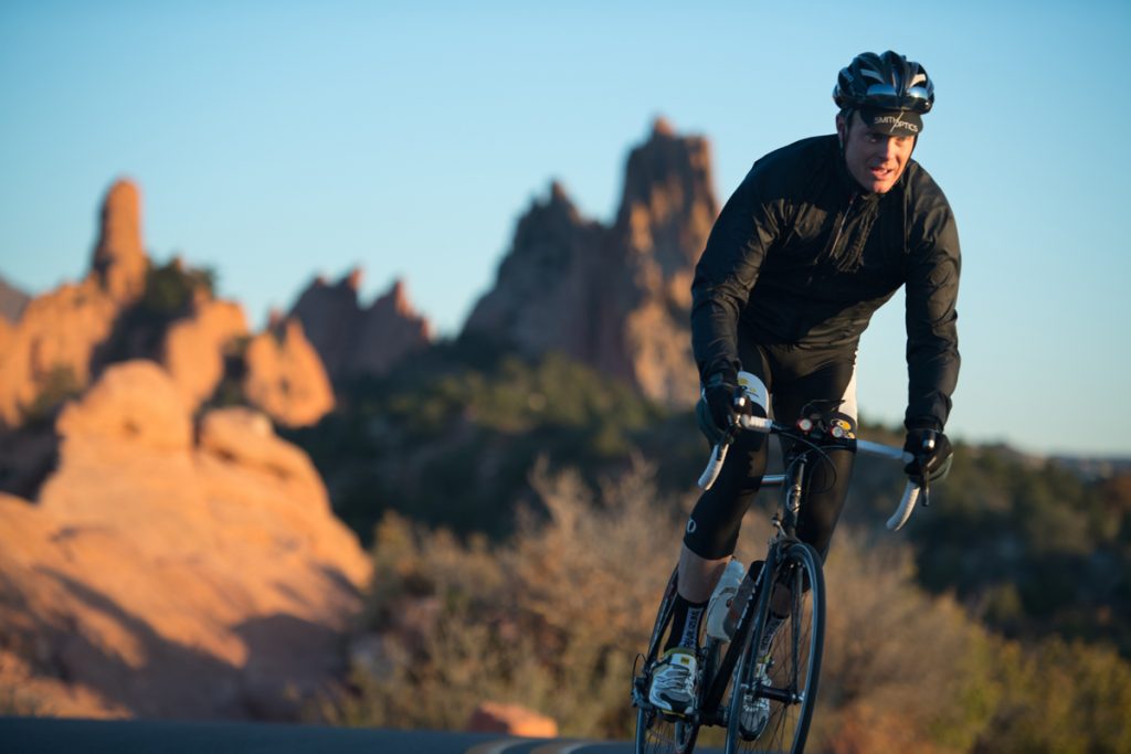 Zach Owen rides his road bike in the Garden of the Gods.