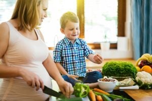 preparing my child for a new baby: pregnant mom with son.