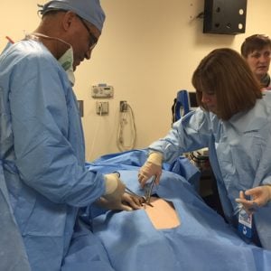 A photo of UCHealth nurses training on a simulator