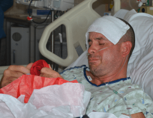 Army Sgt. 1st Class Angel Gonzalez closes his eyes, overcome with emotion in his hospital bed. He suffered a stroke and was treated at what is now southern Colorado's only Comprehensive Stroke Center.