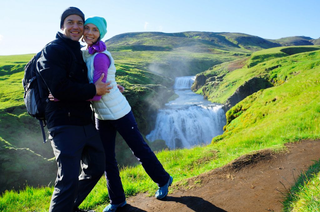 Life-changing ICL surgery has made it possible for Nikole Rachelson to enjoy the outdoors more than ever. Here, she hikes with her husband on an emerald-green slope in Iceland.