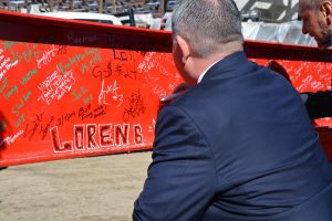 UCHealth Memorial Hospital President and CEO Joel Yuhas signs his named to a steel beam as part of a celebration marking a milestone in construction at Memorial Hospital North.