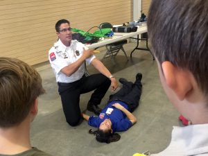 UCHealth Emergency Medical Services deputy chief Braden Applegate desmonstrates how to apply a tourniquet and control bleeding.