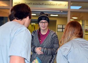A photo of Kate Prewett talking to care providers.