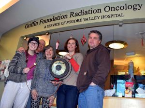 A photo of Kate Prewett with family members after completion of radiation treatment.