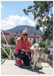 Evelyn Schwandt poses with her dog, Cubella, a yellow labrador.