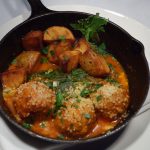 A photo of Jim Cohen's meatballs in a cast iron pan.