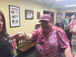 Greg West reaches out to give his fans from UCHealth a hug after performing in the show, Superior Donuts. 