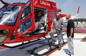 UCHealth's Lifeline helicopter is shown with Flight Nurse Ami Bess in the cockpit. She and Matt Bergland, a flight paramedic, talk to patient Eddie Kerr.