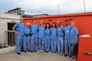 A group of care providers poses outside a clinic in Guatemala City.