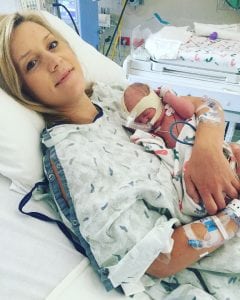 mom holds newborn, who is hooked up to oxgyen because he was delivered via c-section at 35 weeks because mom had placenta accreta.