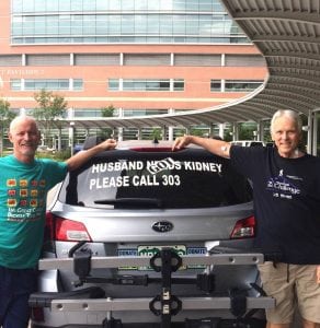 The photo shows Scott La Point, the kideny donor, standing with his kidney recipient, Jim Eastman. They are posing with the car that had the sign, "Husband needs Kidney." It now says Husband Got Kidney.