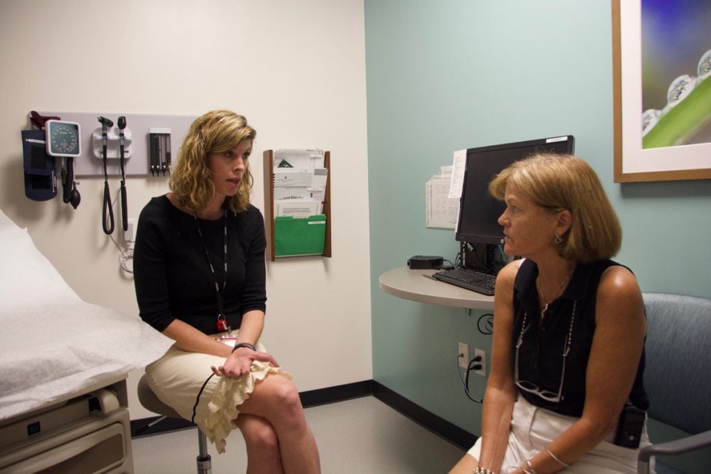 Lauren Tolle, left, a clinical psychologist, meets with patient, Trisha Washburn, right, at the UCHealth Family Medicine Clinic in Westminster. Tolle is helping Washburn cope with anxiety.