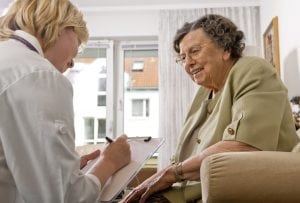 An older woman gets help from a medical provider. Is marijuana safe for older adults | UCHealth