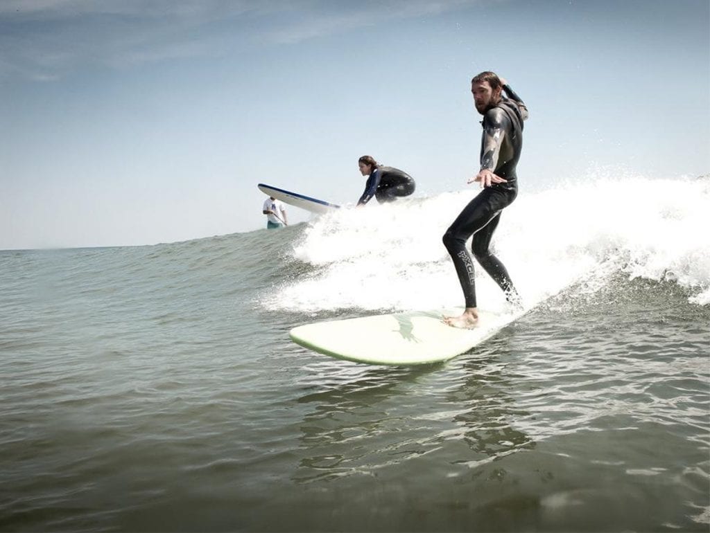 A man surfing.
