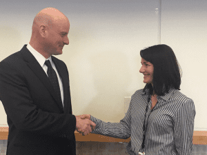 Nurse Practitioner Amanda Brill shakes hands with Dr. Ethan Cumbler