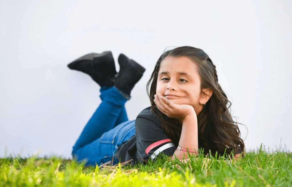 A photo of Grace Cuellar in the grass.