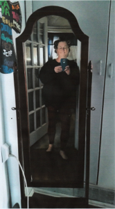 Marshall takes a selfie in front of a mirror. She says she and her sister joked about how skinny her legs looked in this picture after her weight loss. 