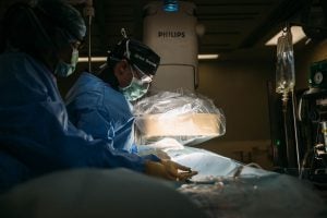surgeons performing surgery to treat mitral valve disease in dogs