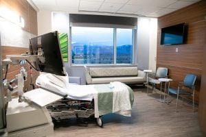 A hospital room with a view toward the mountains in Colorado Springs.