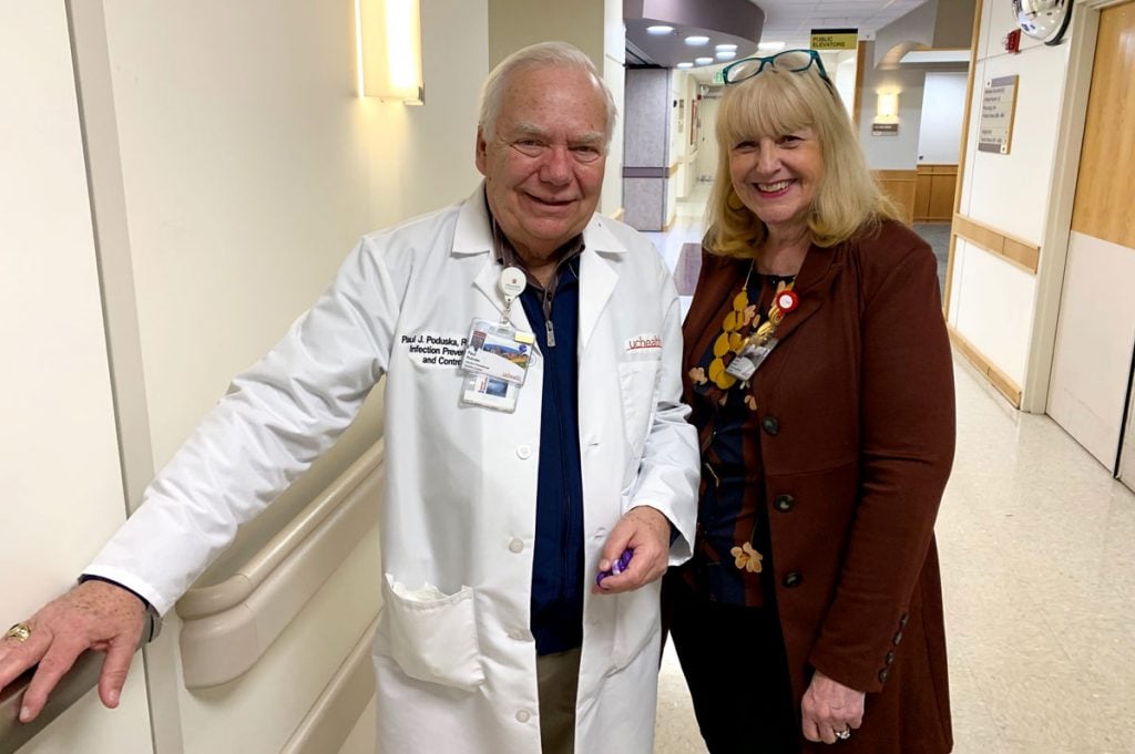 couple stands in hallway of hospital