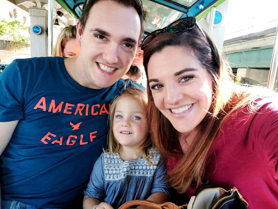 selfie of mom, dad and toddler.