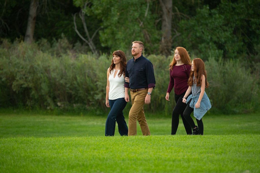 A photo of Marie Newbrough with her family in a Colorado Springs park.
