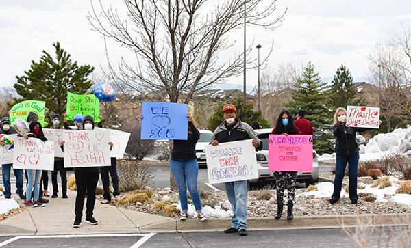 JBS worker and COVID-19 survivor, Sergio Rodriguez, was greeted by family members with signs.