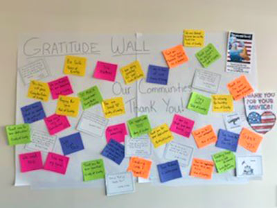 letters from Colorado residents thanking health care workers are posted at the employee entrance of Greeley hospital.
