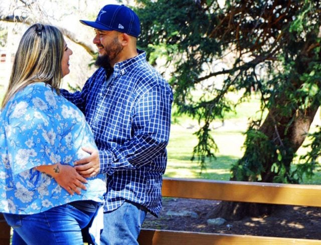 Pregnant Jade and Mike in a park. Jade would give birth while covid-positive at 35 weeks pregnant.