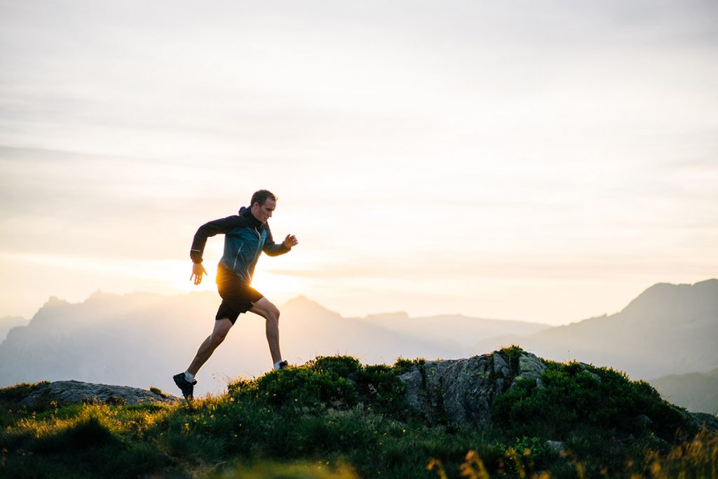Paying attention to tips before you start running will keep you safe, like this man atop a mountain.