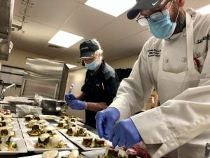 Executive Chef Charters plates second course of meal