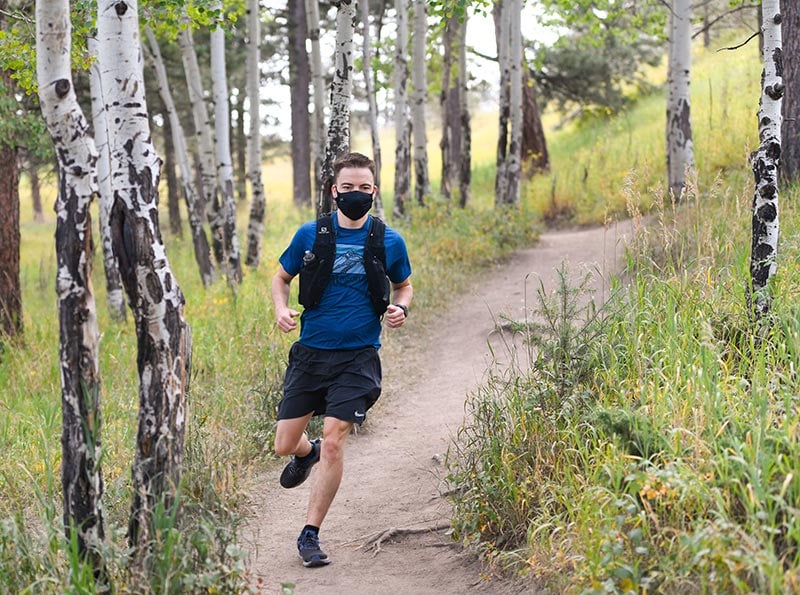 Matt Johnston learned as a young adult that he had a congenital heart defect and took up running. Here, he runs through an aspen grove.
