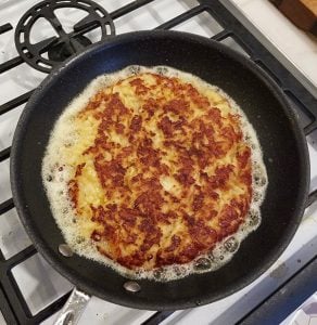 Persian tahdig in a pan on the stove.