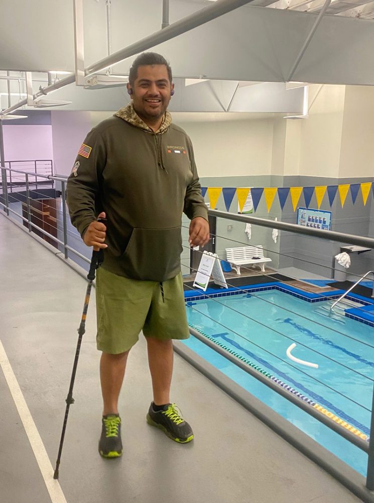 Edgar using the walking track above a pool after his stroke