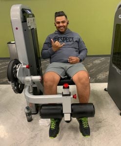 Edgar giving the hang loose sign at the gym after recovering from a stroke.
