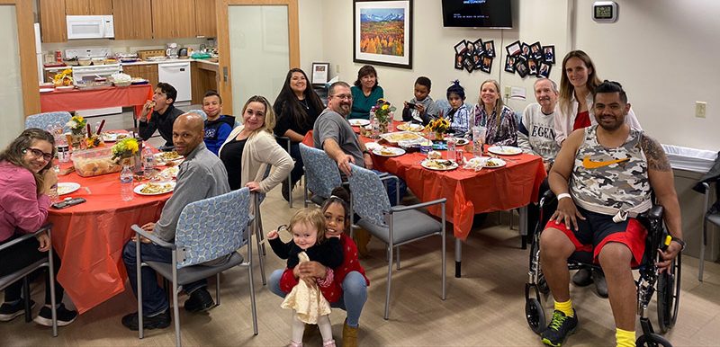 family enjoys thanksgiving feast in the hospital's rehab unit.